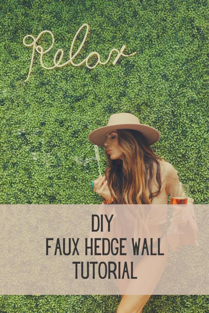 diy photo wall backdrop made out of faux greenery