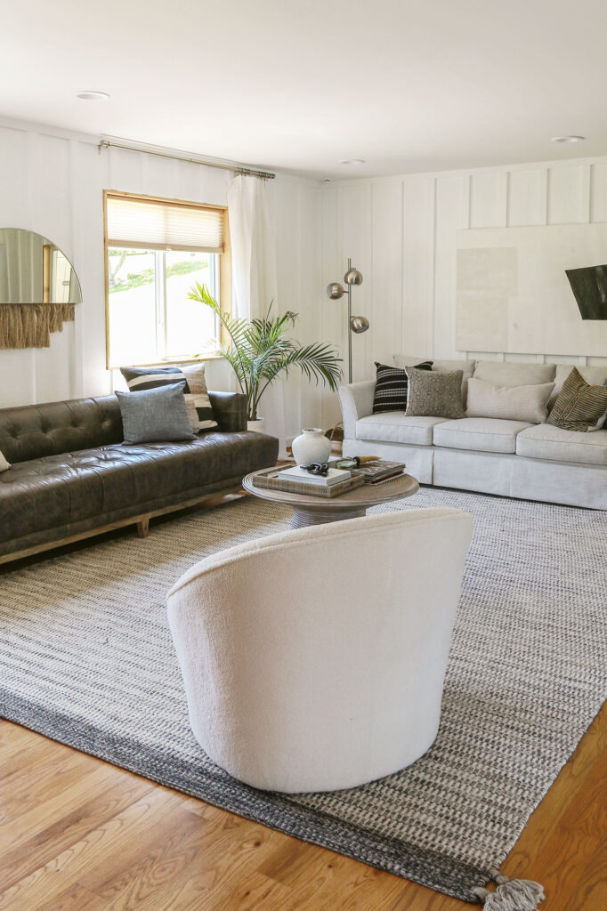 cozy boho living room with neutral decor and white walls 