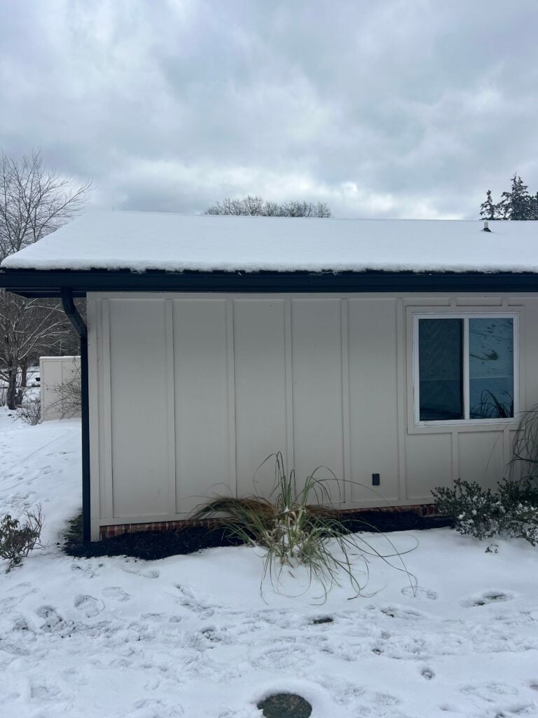 Sherwin Williams Shoji White on home exterior contrasting with the snow on the roof and the ground