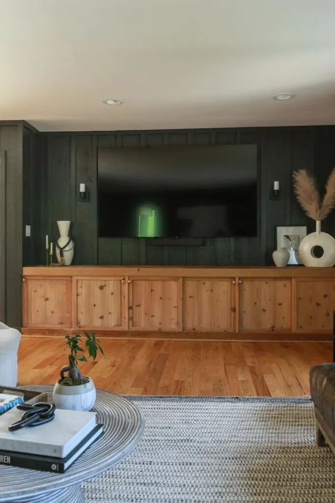 black accent wall behind tv in living room