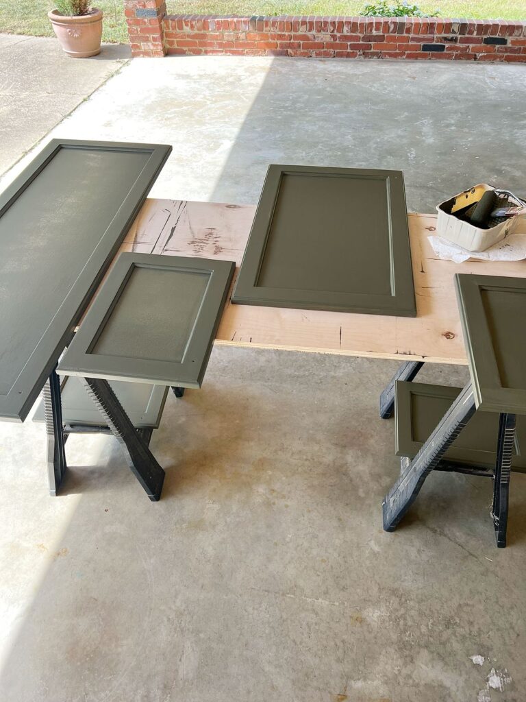 cabinet doors curing outside after one coat of Emerald Urethane paint