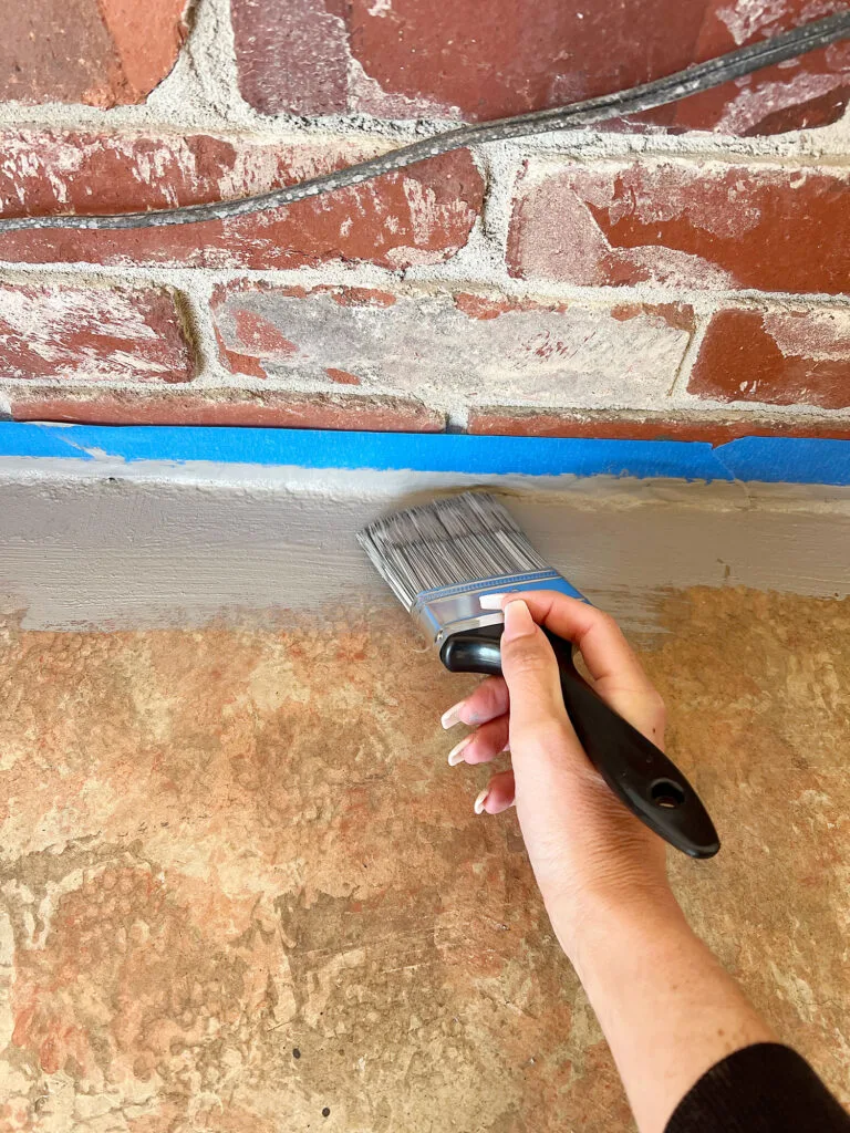 painting boarder of porch floors with concrete paint 