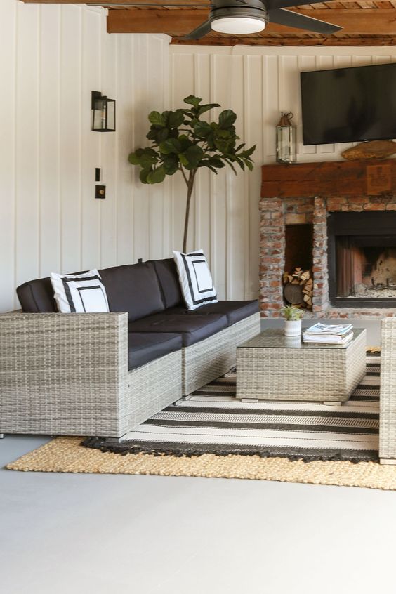modern black and white rug and outdoor sofa on patio