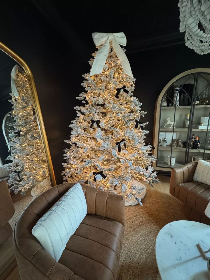 flocked christmas tree with black ribbons for ornaments