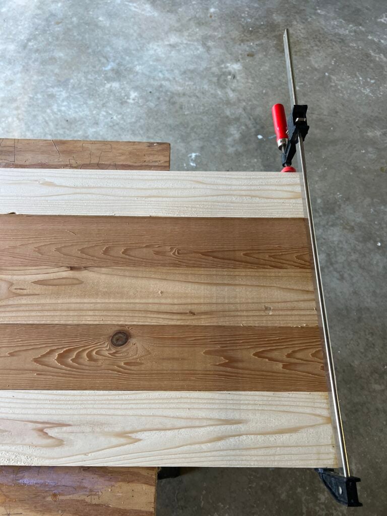 clamping cedar boards together to form a shutter