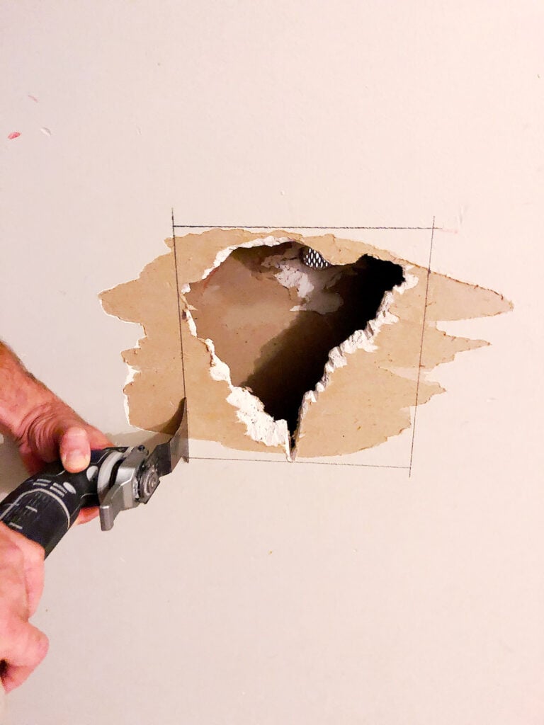 cutting drywall with saw
