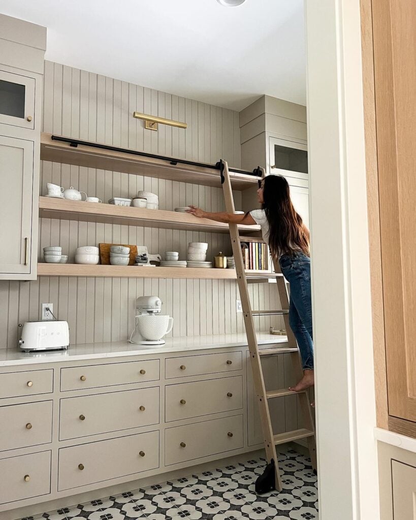 pantry with white quartz and greige cabinets painted in Stone Hearth by Benjamin Moore