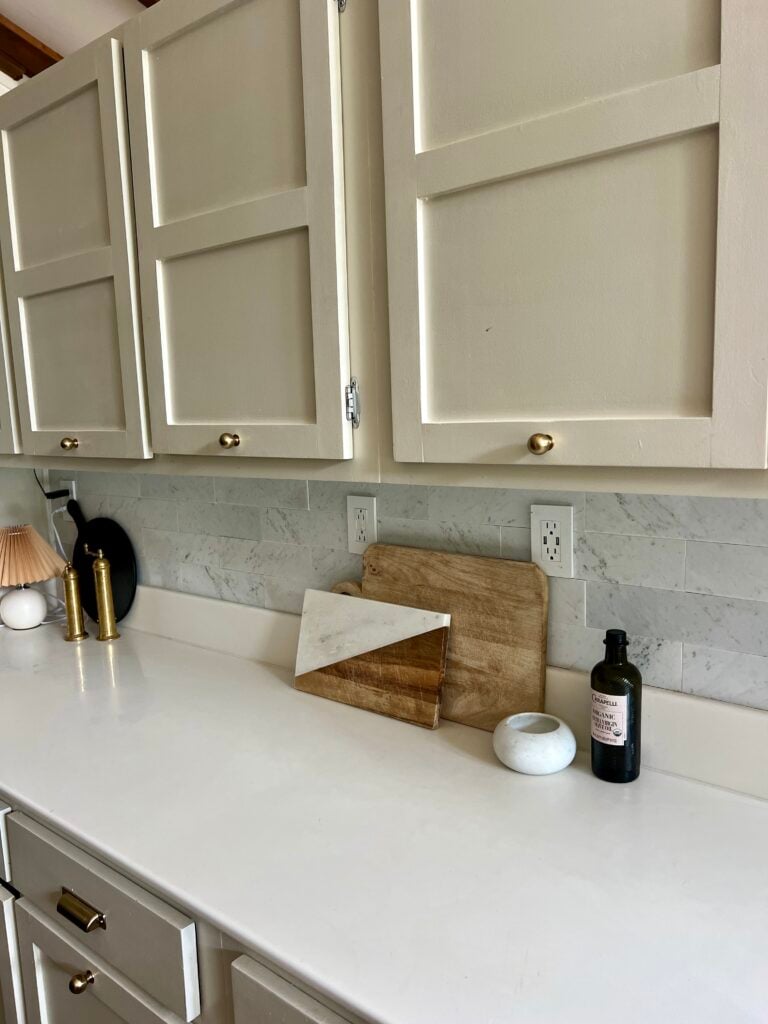 close up of marble peel and stick tiles after one year of use in my kitchen