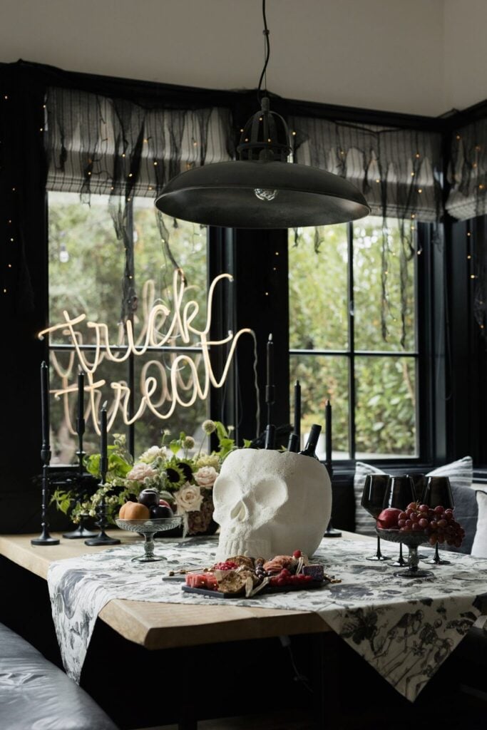 moody chic dining room decorated with edgy halloween decor 