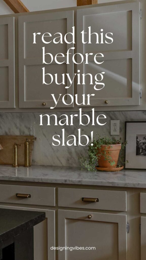kitchen with polished marble countertops and backsplash paired with natural cream cabinets and brass hardware
