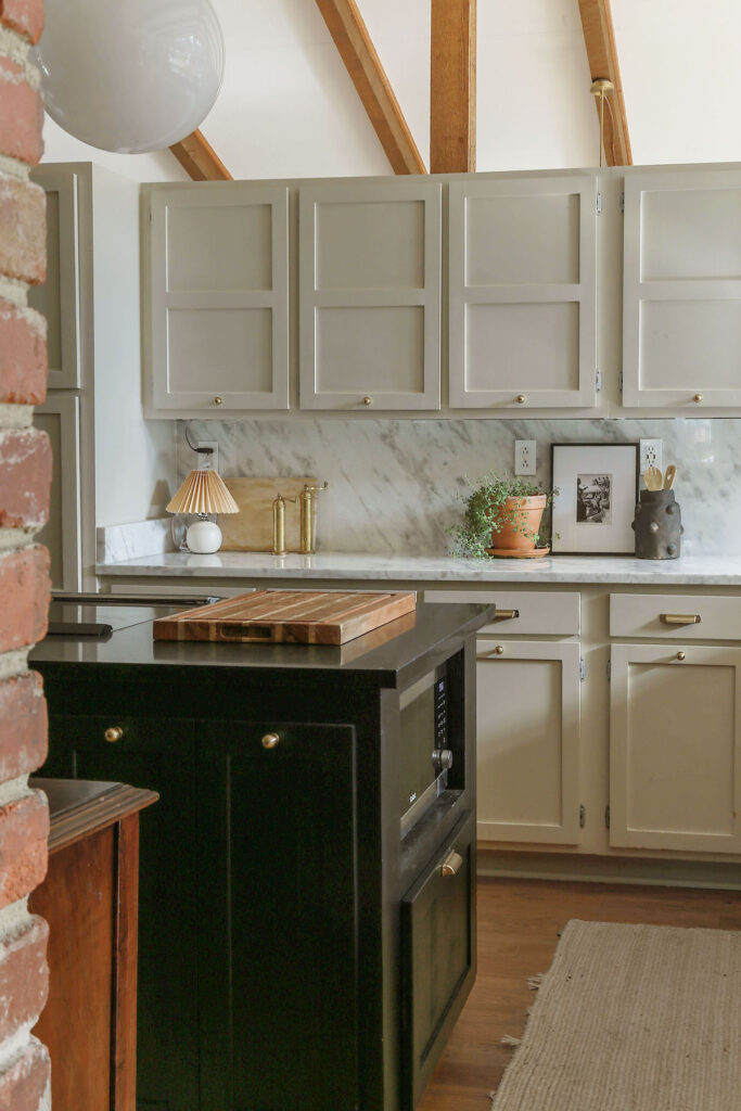 kitchen with marble countetops and greige cabinets painted diy style using emerald urethane by sherwin williams 