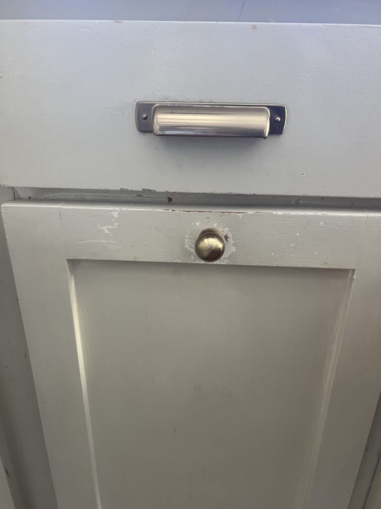 emerald urethane cabinet paint showing signs of wear and tear after 2 years of high traffic use on kitchen cabinets