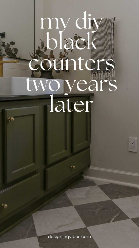 diy black countertops made from plywood in chic moody bathroom
