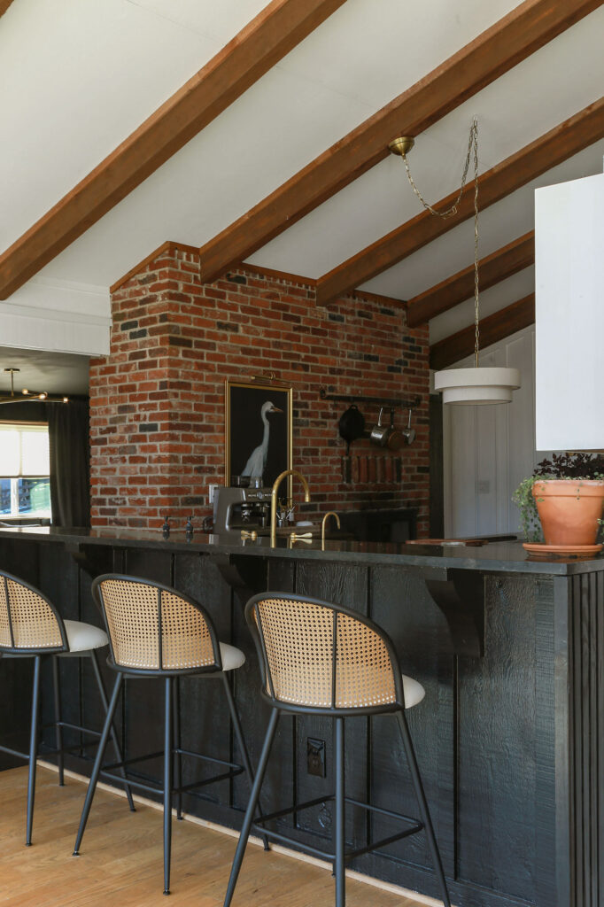 bar painted in Tricorn Black by Sherwin Williams paired with black honed granite countertops