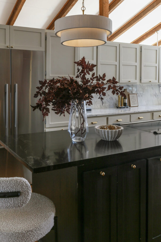 kitchen cabinets on island painted in Tricorn Black by Sherwin Williams 