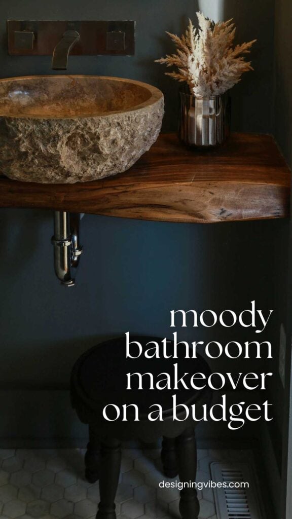 dark moody powder room with travertine vessel sink and wood vanity