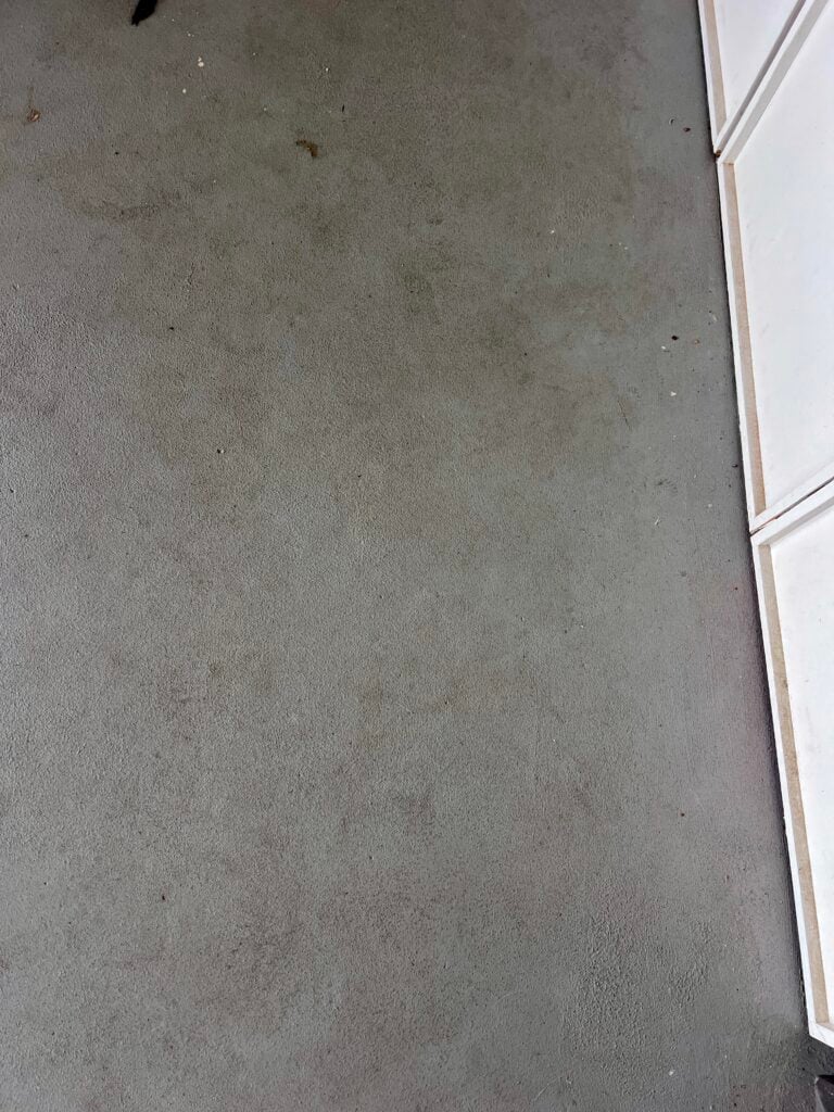 dirty patch of painted concrete floors that are hard to clean