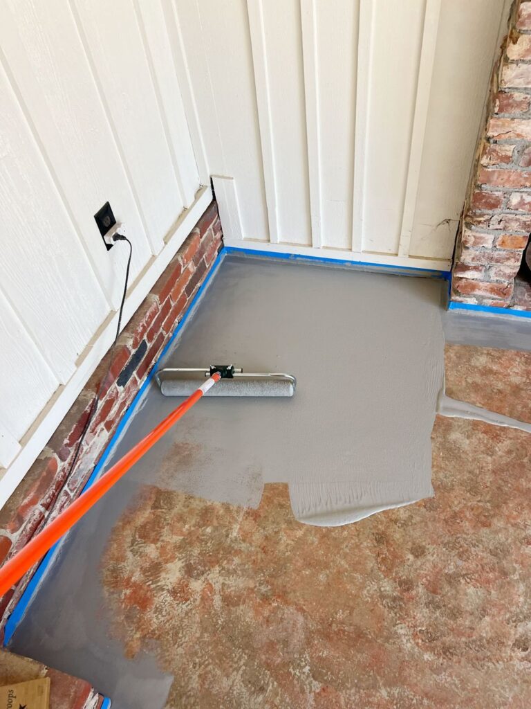painting concrete floors with masonry paint using a paint roller