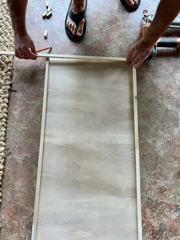 adding dowel rods to plywood cabinet panels to build a slim shaker cabinet door for kitchen