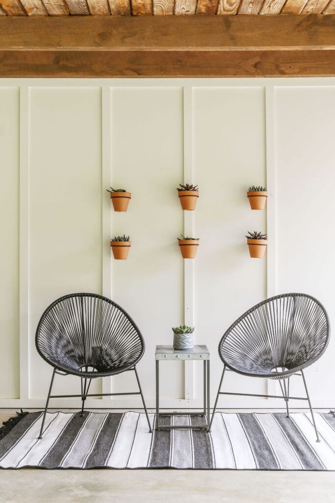 diy outdoor wall art on white home exterior with charming curb appeal