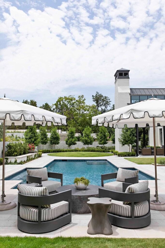 conversation set of 4 arm chairs in front of a pool