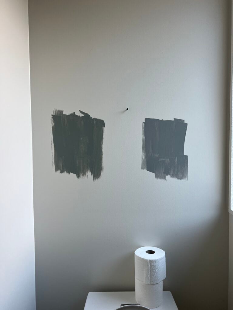painted sample on wall of Duxbury Gray by Benjamin Moore looking green-gray