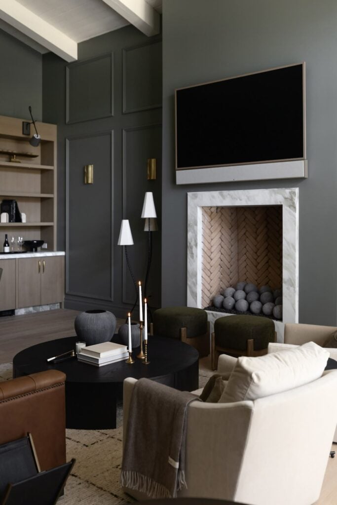 living room walls painted Duxbury Gray paired with white ceiling and marble fireplace surround