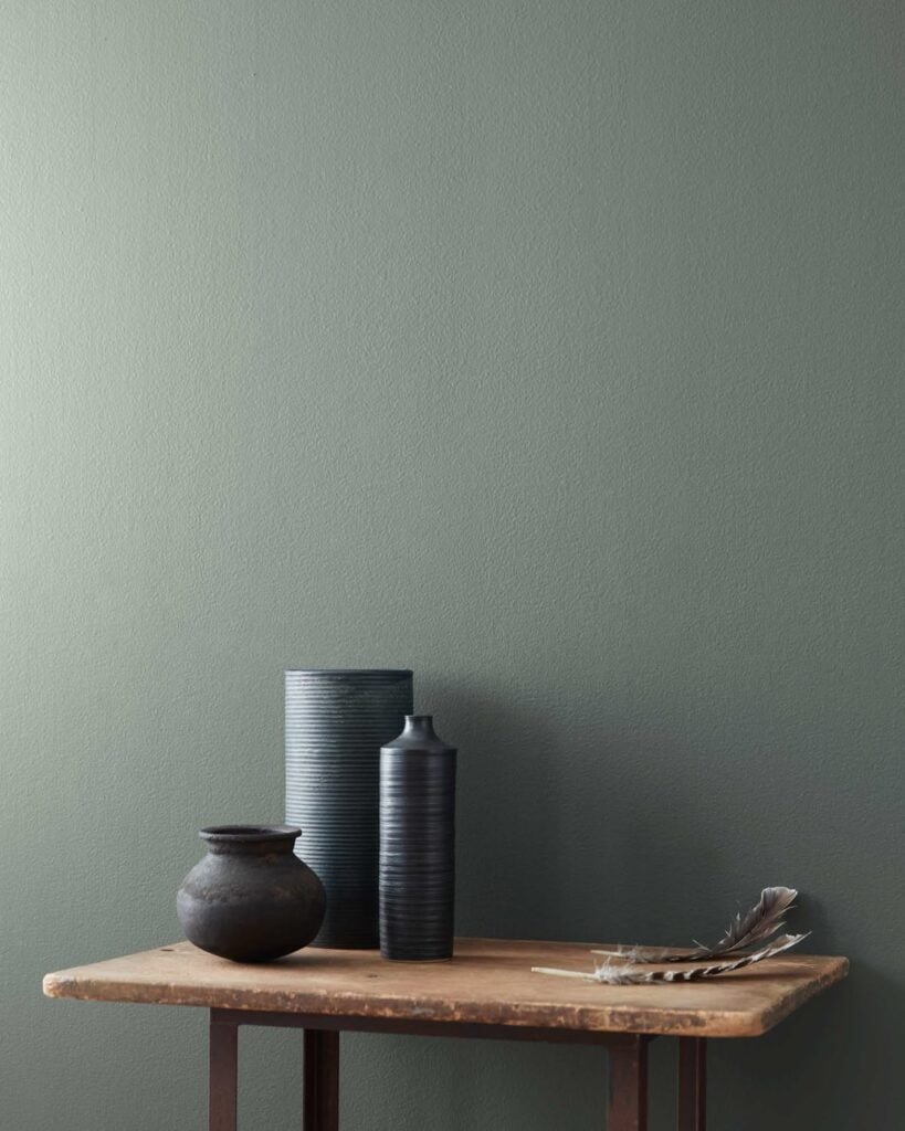 duxbury gray , a green blue gray paint color, on walls paired with wood furniture 