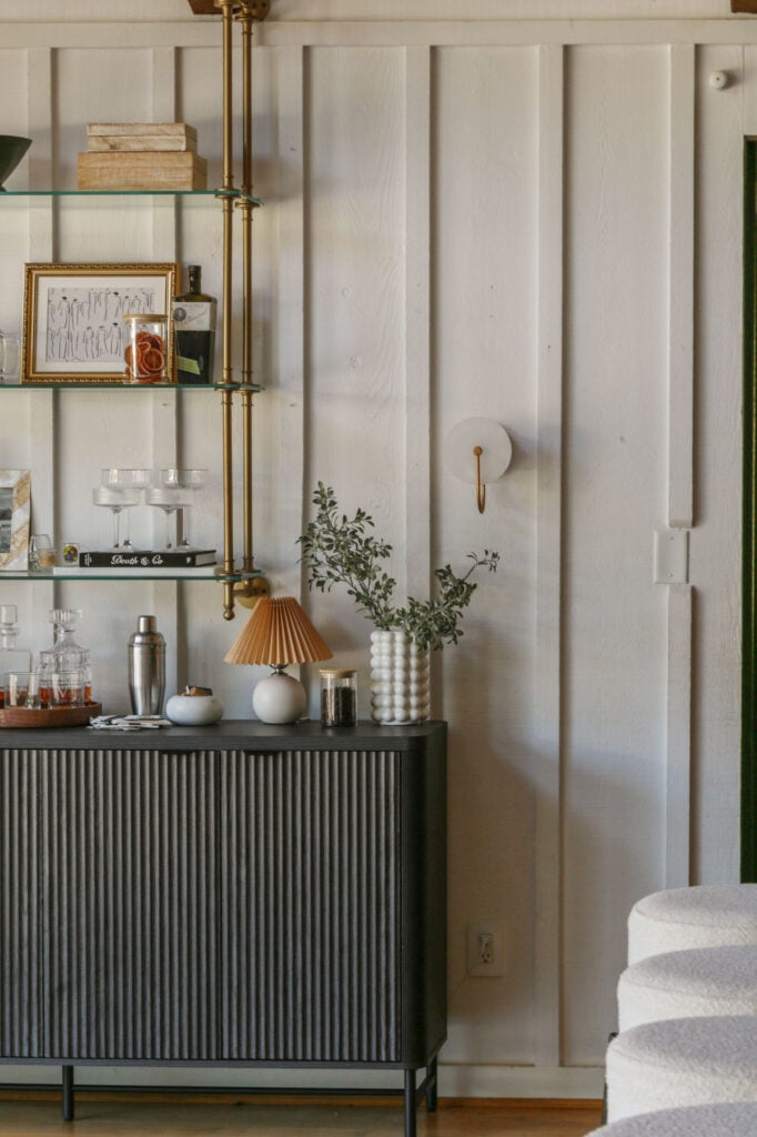 Kitchen bar reveal featuring affordable brass bistro shelves and layered bar styling