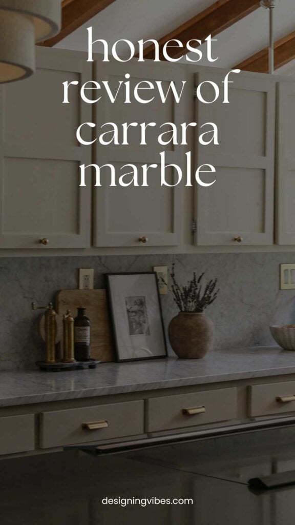 honed carrara white marble in kitchen with natural cream cabinets and brass knobs 