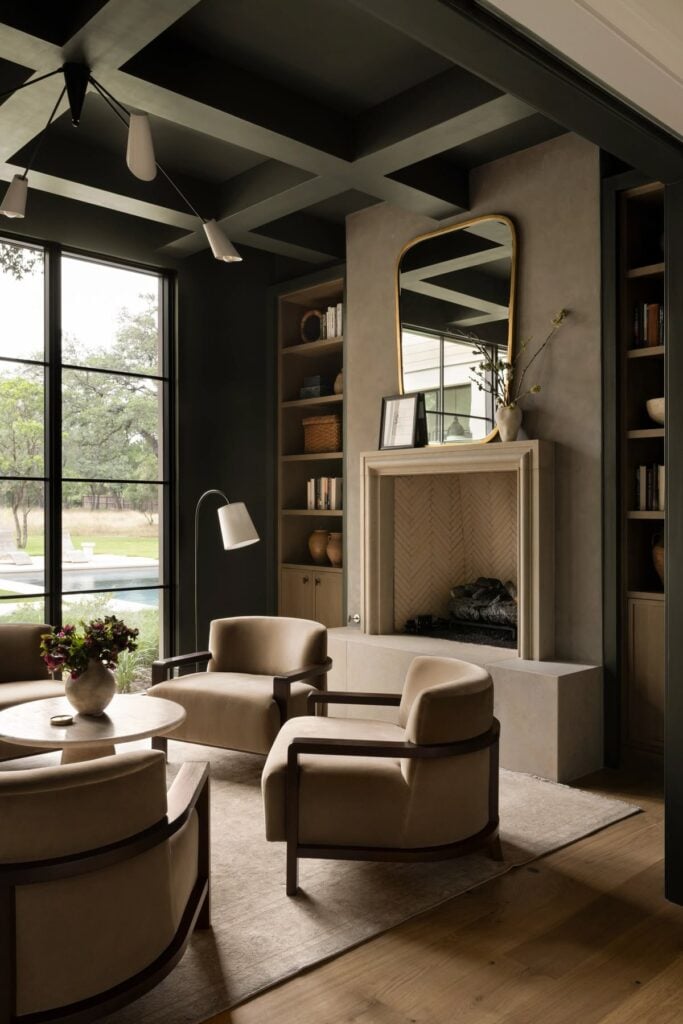 earthy, neutral living room painted in dark green color called rock bottom by sherwin wiliams