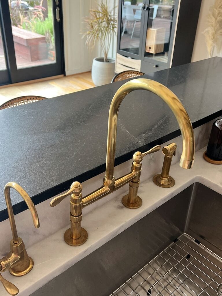 Unlacquered Brass Faucet in kitchen when it was first installed on year ago