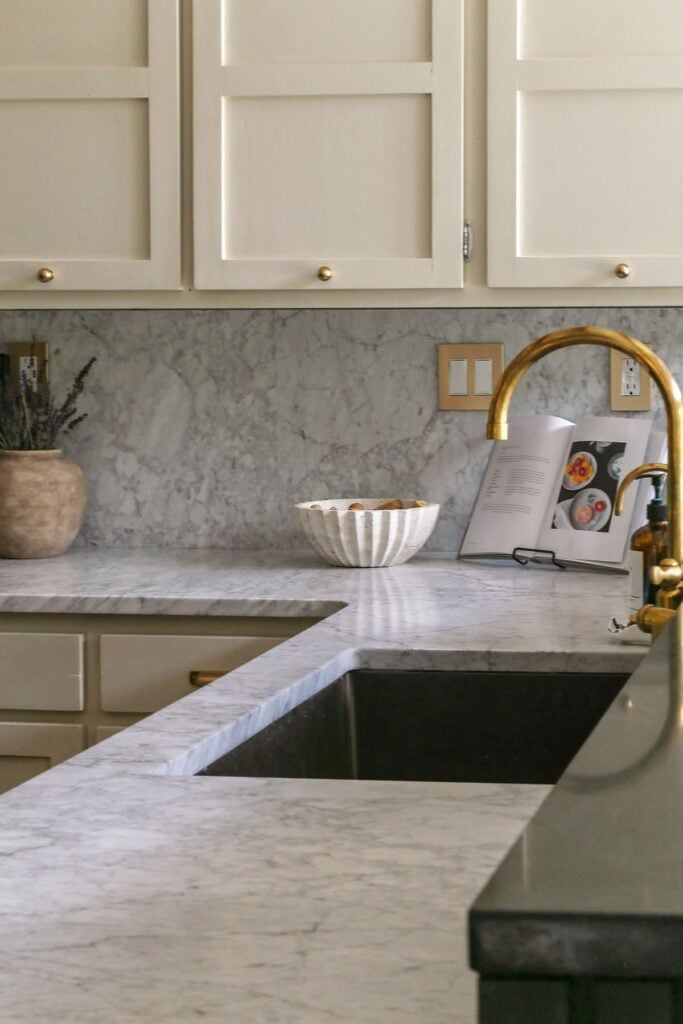 kitchen with marble countertops and Unlacquered Brass Faucet 