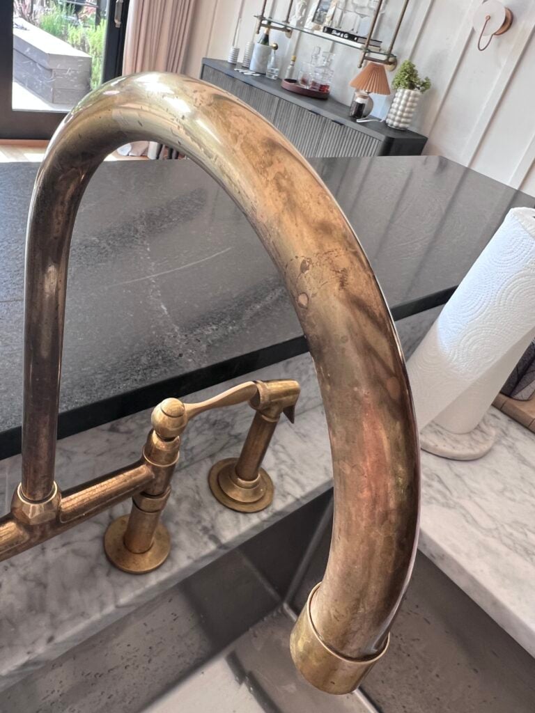 close up of patina on a Unlacquered Brass Faucet after one year of use in a kitchen 