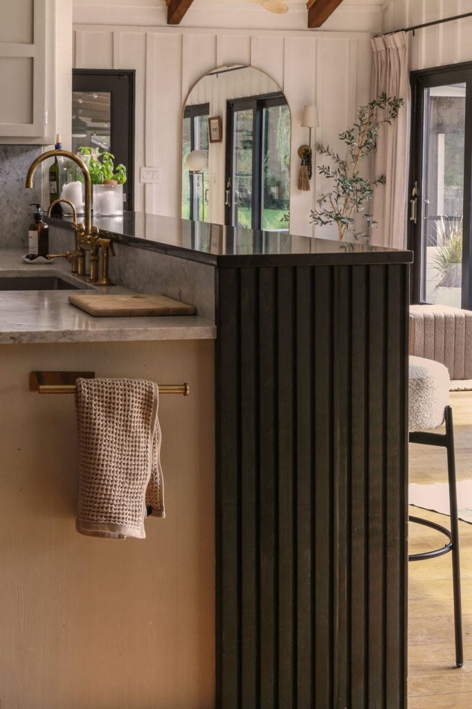 framing in a kitchen bar with a diy waterfall countertop with reeded detail