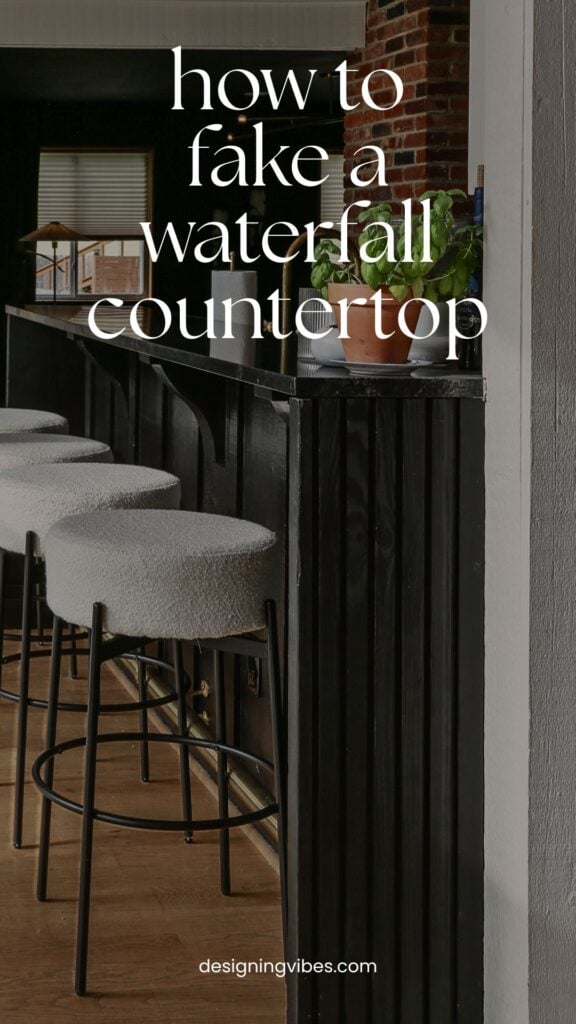 faux waterfall countertop painted black to match granite counters on raised kitchen bar