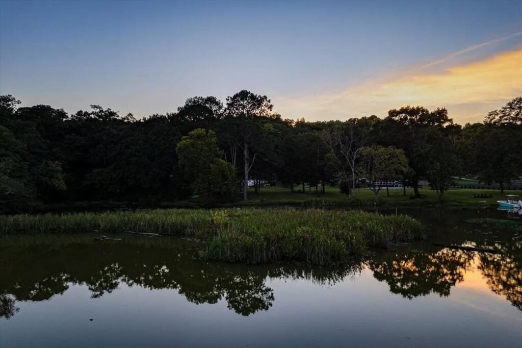 lake view behind white cottage