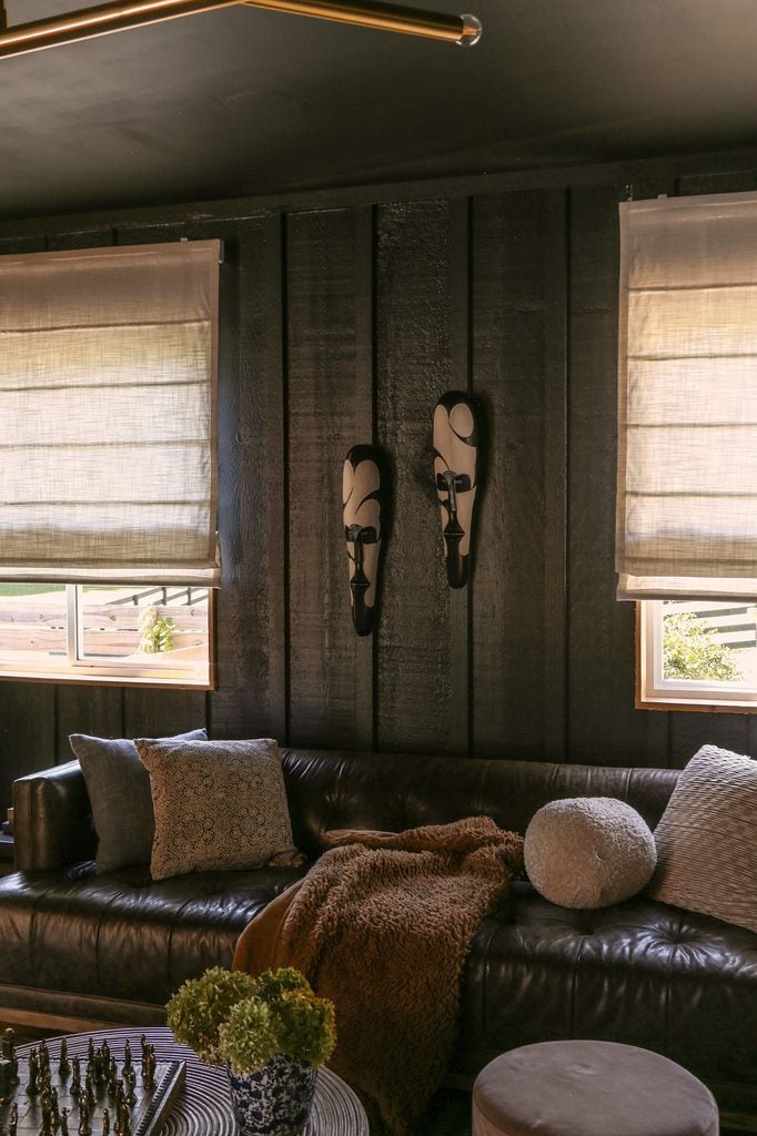 linen roman shades from freshine in dark, moody living room 
