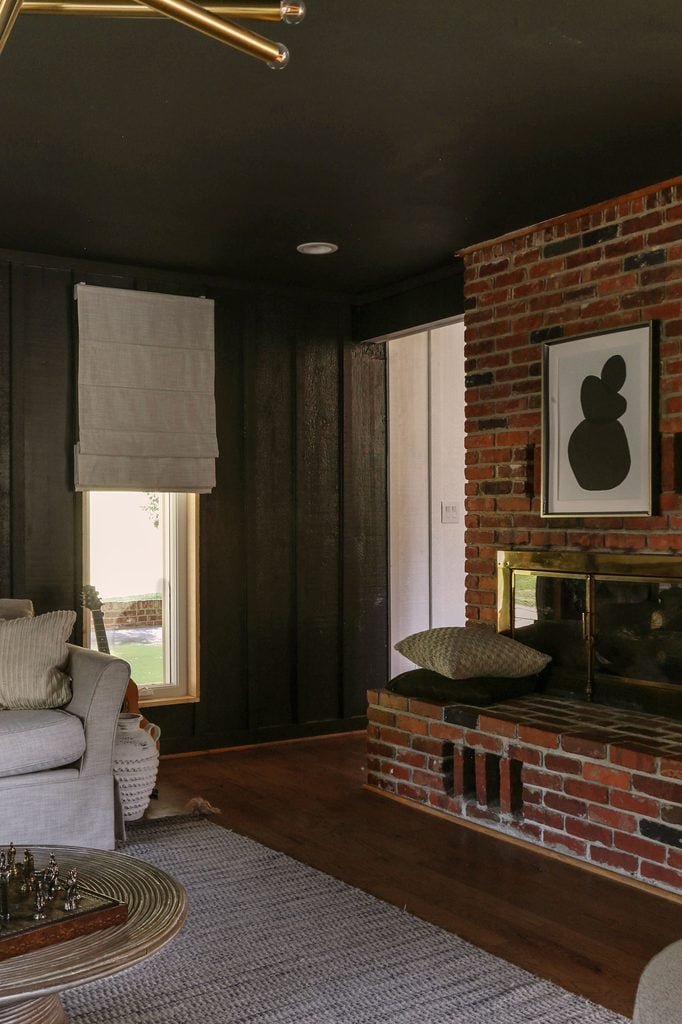 custom linen roman shades iin living room color drenched in iron ore by sherwin williams