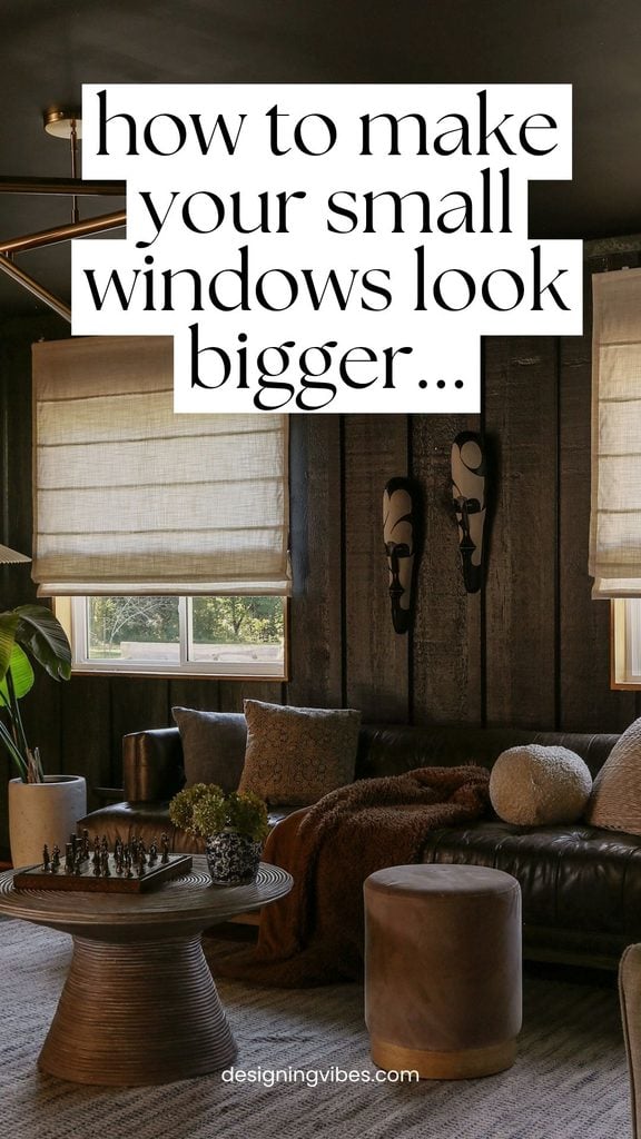 outside mount linen roman shades hung higher than windows to look bigger in a color drenched moody modern living room 